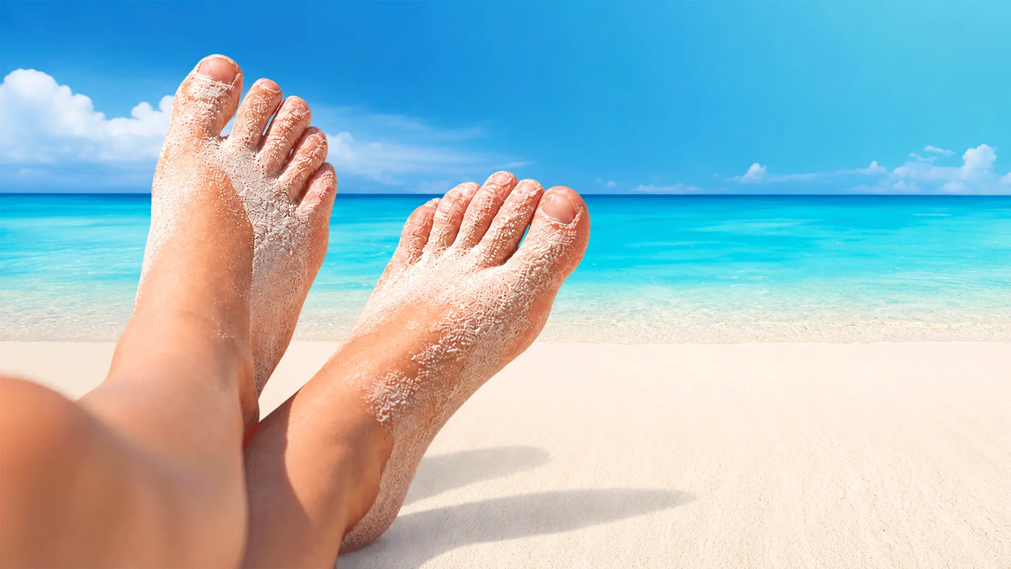 sandige Füße am Strand